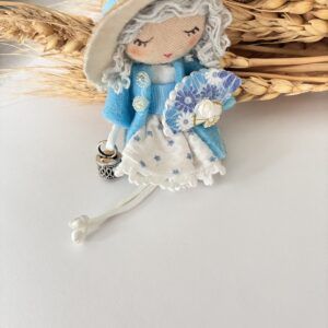 Broche Muñeca